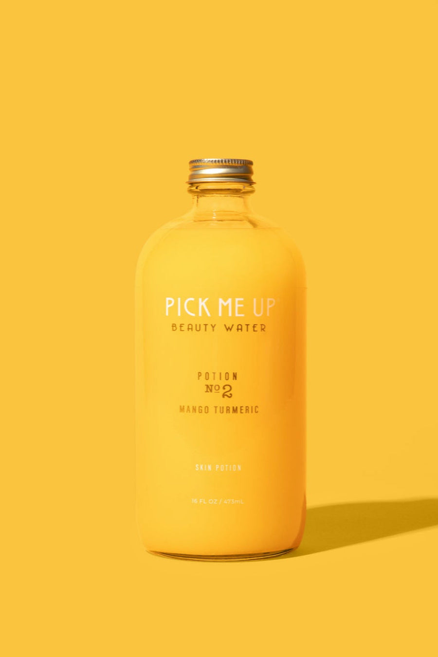 Pick Me Up PotionsMango Turmeric drink – functional skincare beverage for glowing hydrated skin, made with hyaluronic acid and antioxidants.